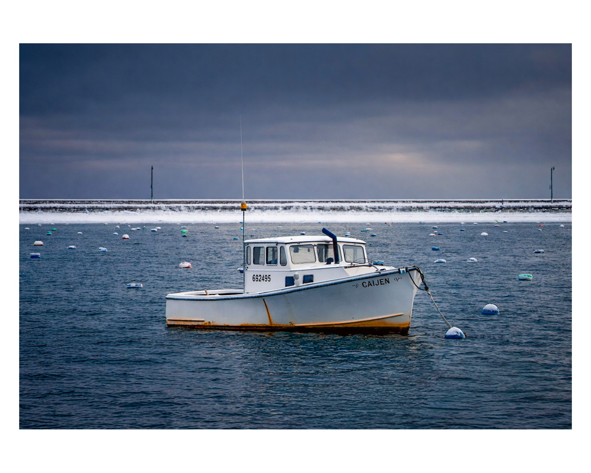 Lobster boat in a winter harbor on the North Shore of Massachusetts