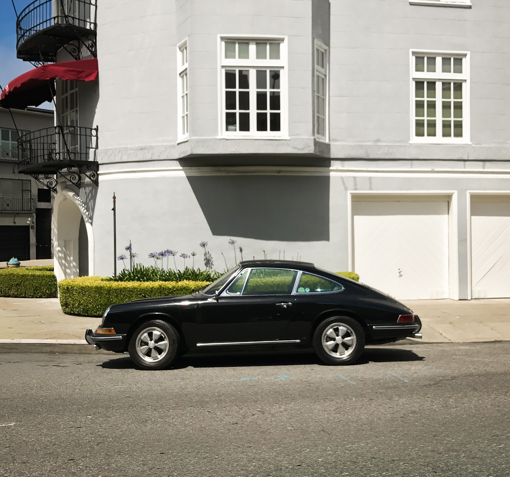 Vintage Porsche parked on a quiet residential street in San Francisco, California