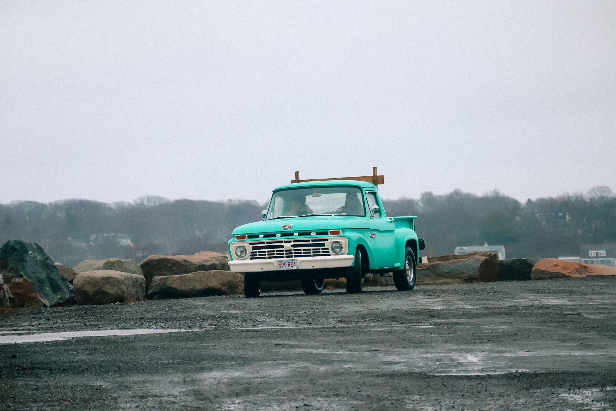 Vintage Ford pickup truck parked near the harbor in Rockport Massachusetts during a coastal storm