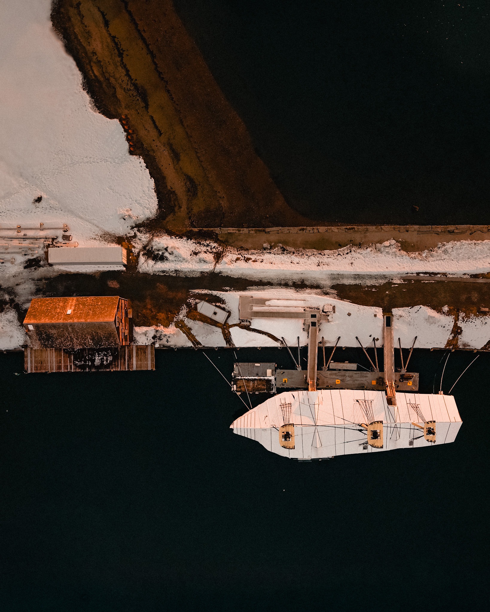 Aerial view of Derby Wharf and the Friendship docked along the working waterfront, Salem Harbor Massachusetts