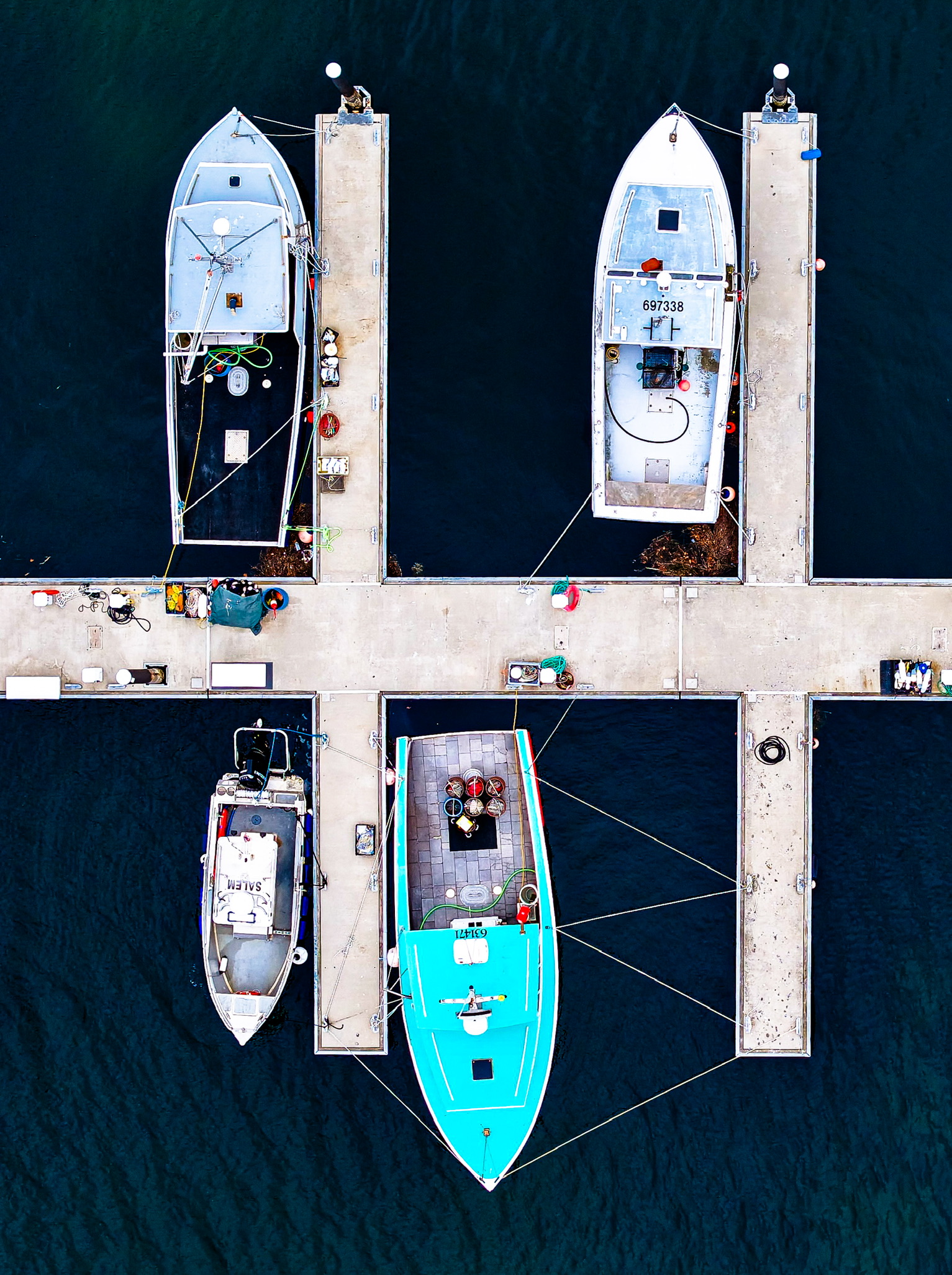 Aerial photograph of a dock with working boats tied up in Beverly Harbor Massachusetts